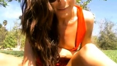 Small titted brunette Sharron with glasses masturbates