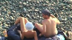 Voyeur on public beach. Oral sex